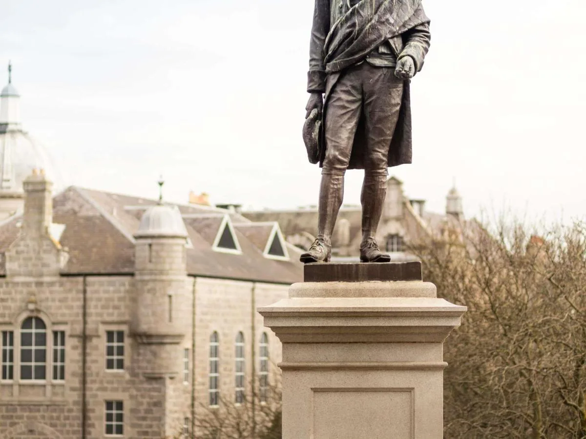 a statue of a man standing in front of a building at ibis Aberdeen Centre – Quayside in Aberdeen